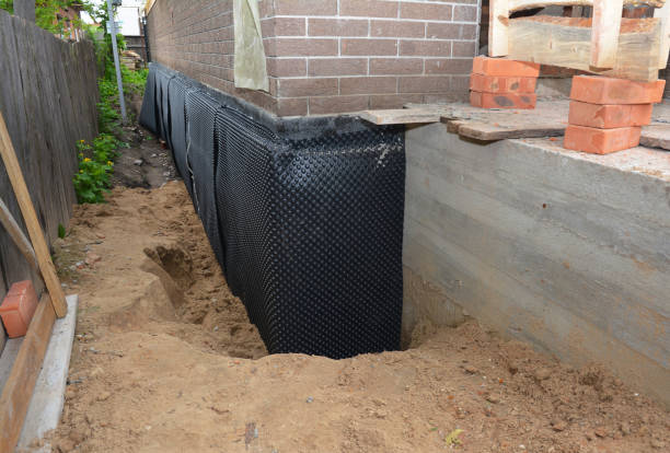 Happy homeowners after waterproofing job in Greenfield